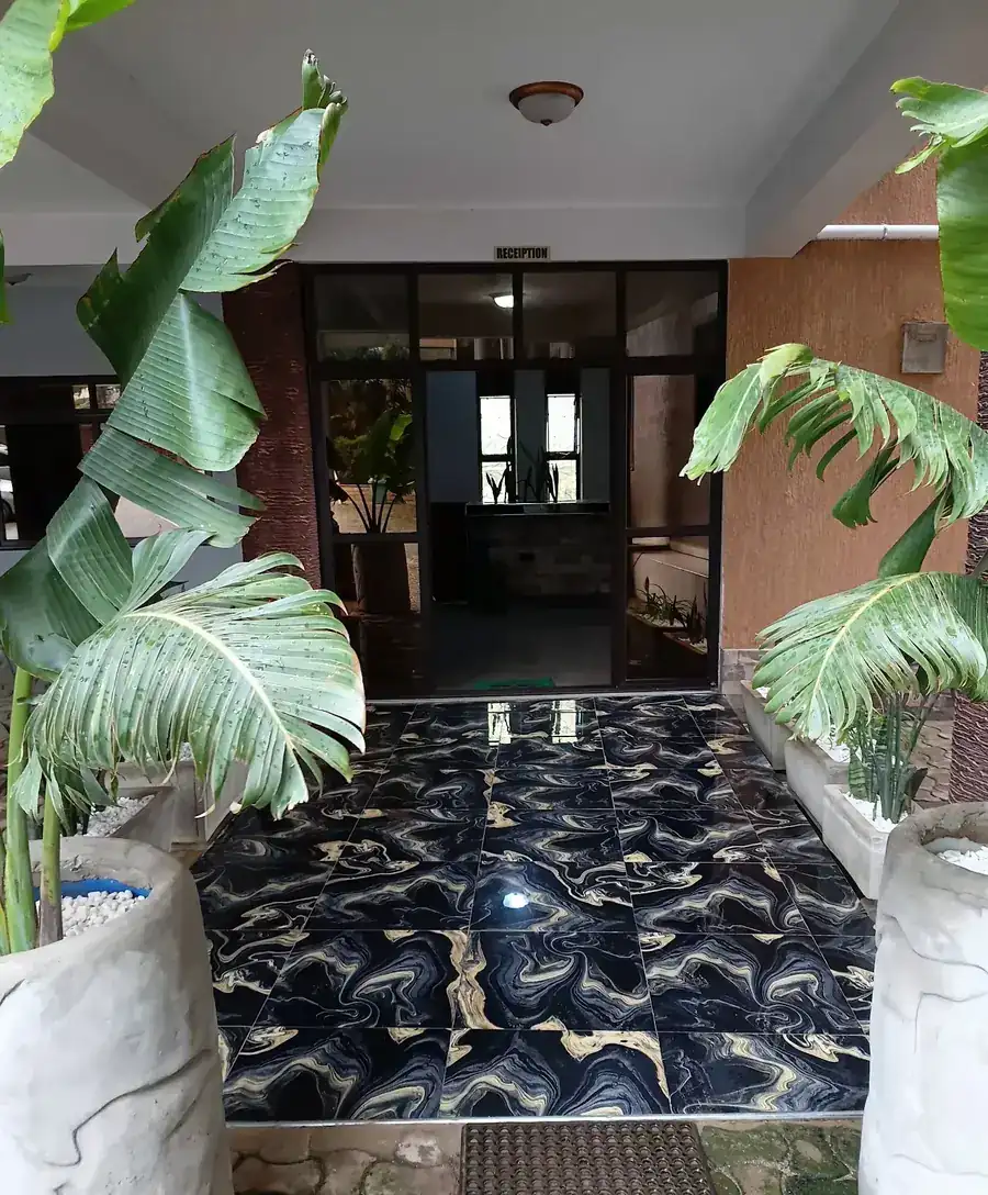 Relie Motel entrance with potted plants